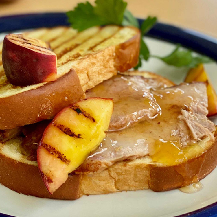 Picture of Roasted Pork Shoulder with Grilled Peaches and Peach Glaze