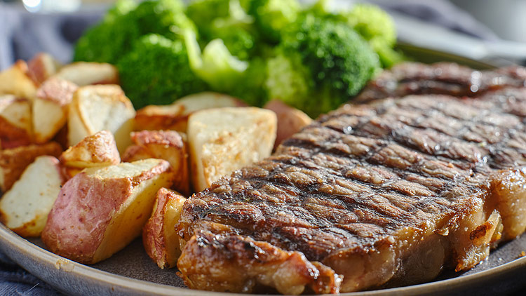 Picture of Bone-In New York Strip Steak with Roasted Potatoes